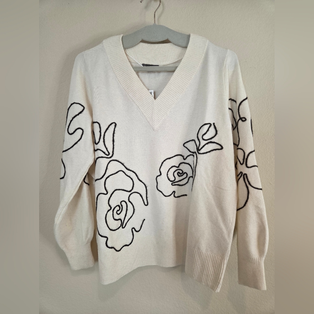 Elegant Cream Sweater with Floral Design